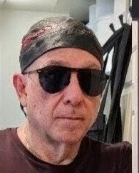 Tony Lawand as the biker