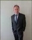 Tony Lawand as blue suit